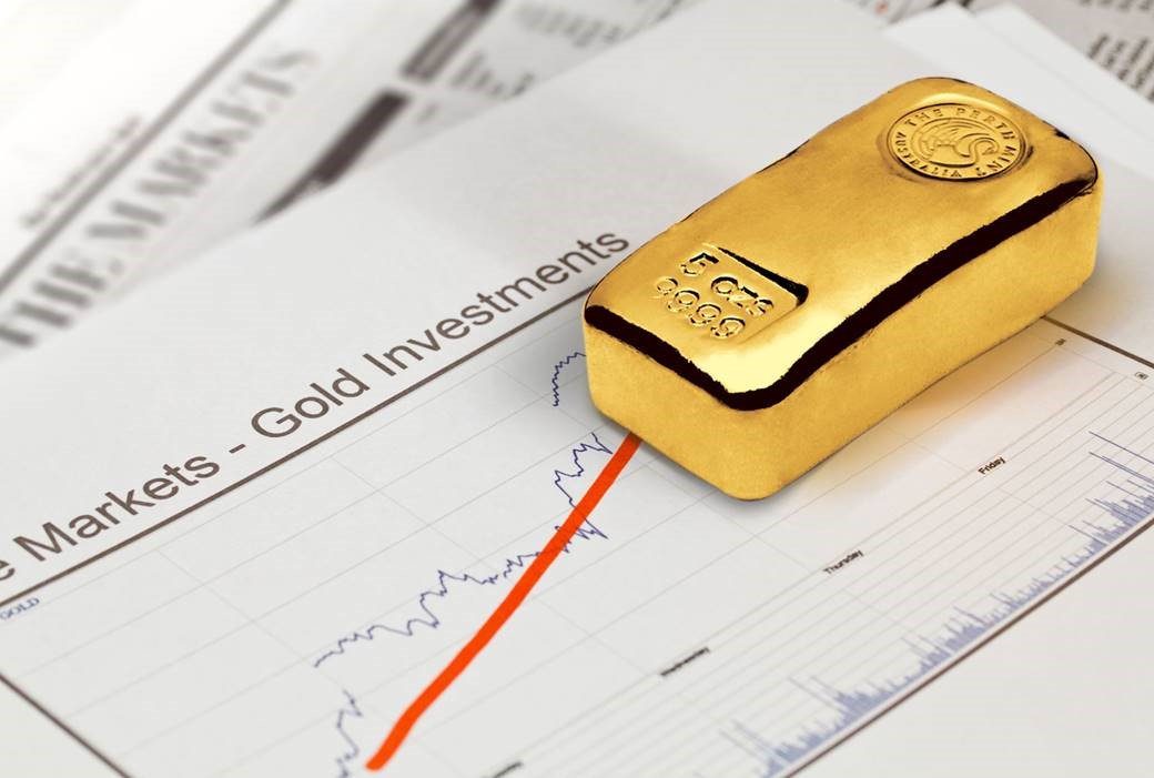 an image of a Perth mint gold bar on investment paperwork