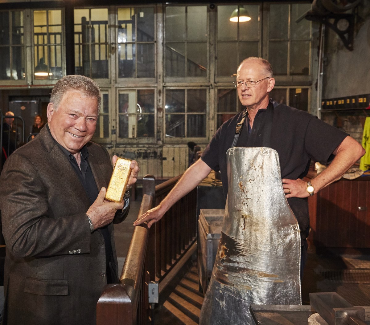 William Shatner holding a gold bar at The Perth Mint