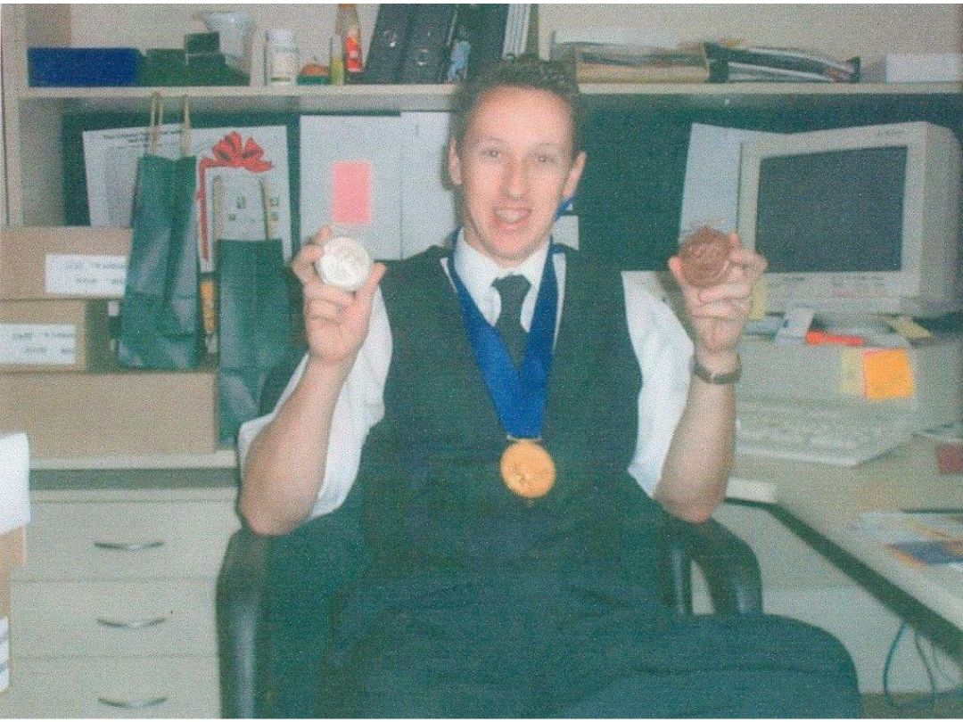 Pictured: Gordon Smith with his medallions produced at the Mint.