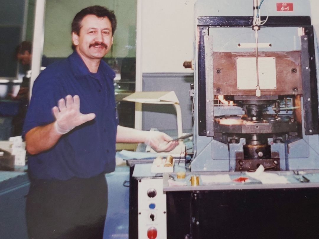 Pictured: Neil Rogers operating an auto press in the 1990s.