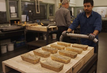 a Perth Mint working pushing a dore trolley