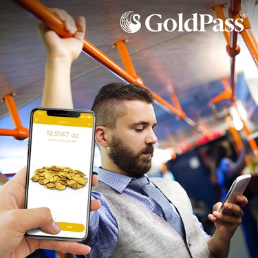 Man on a train looking at his phone, the GoldPass app is shown in foreground