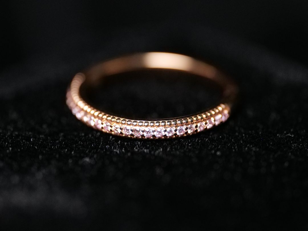 Grain or bead-set diamond wedding band set in rose gold