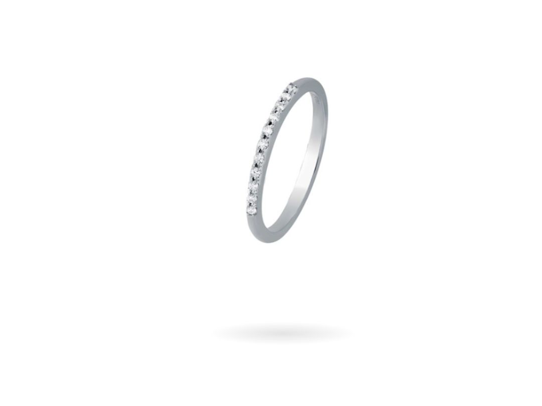 channel-set eternity band with a row of white diamonds