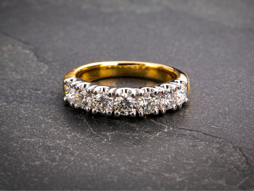 Beautiful claw-set diamond wedding band set in yellow gold