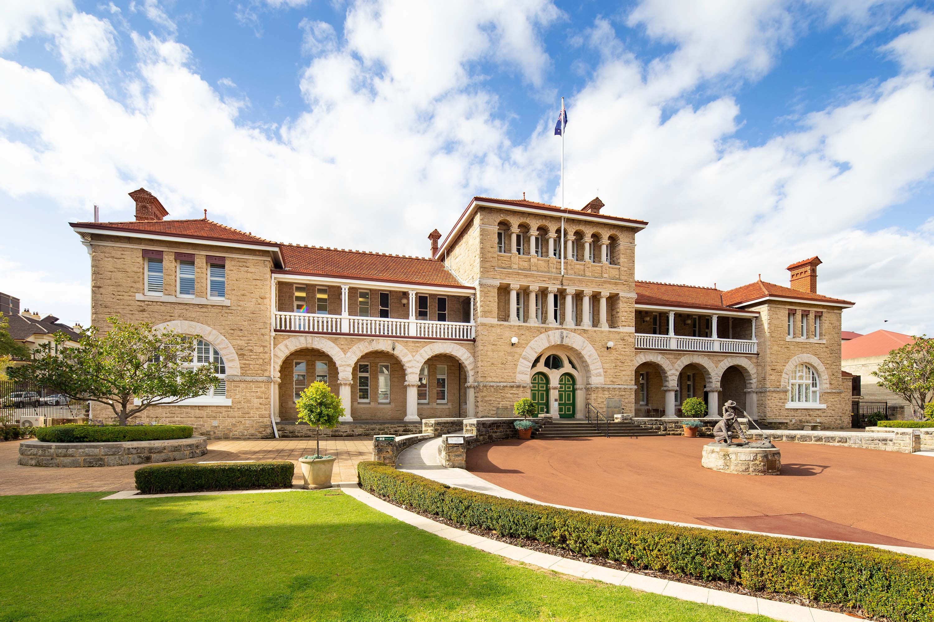 Exterior of The Perth Mint showing forecourt and sky.