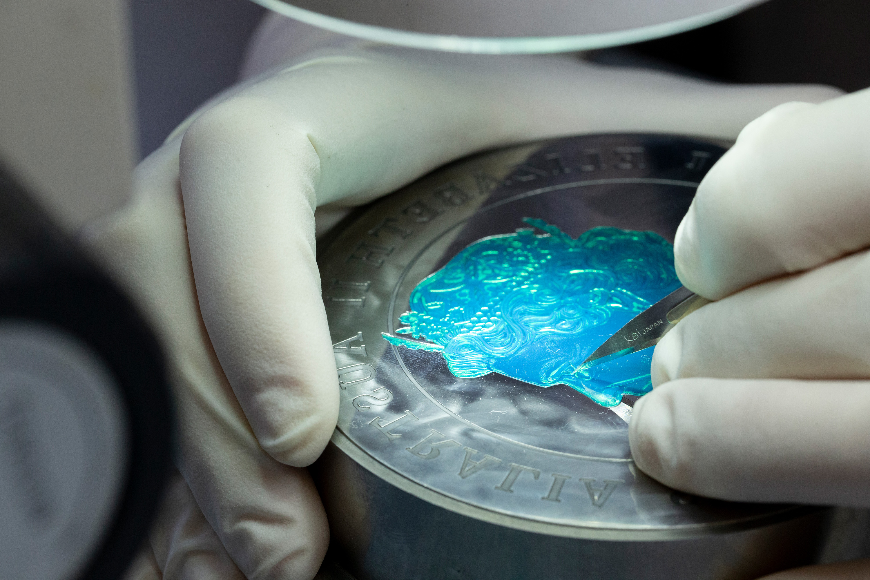 Preparing collector coins for sale at The Perth Mint.