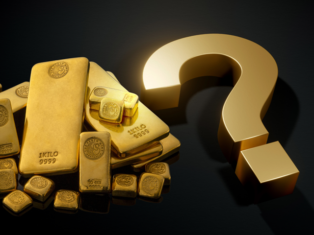 Assortment of gold bars with question mark. 