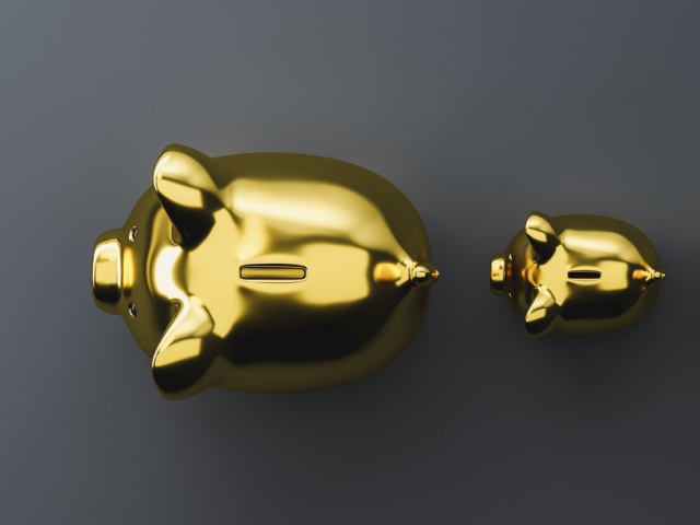 a birdseye view of a large and a small gold piggy bank