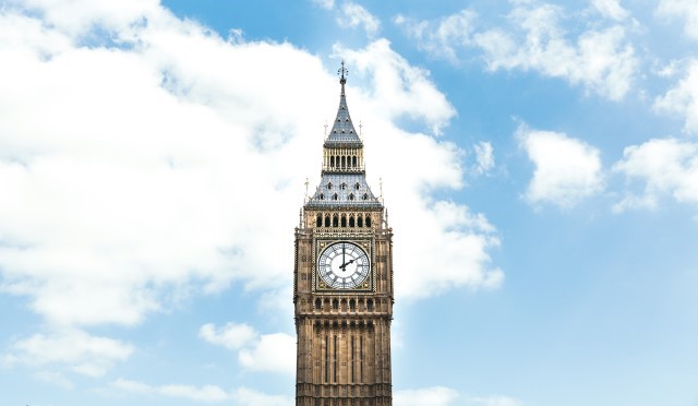 Big Ben the clock tower against a blue sky with clouds