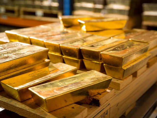 an array of Perth Mint gold bars on a pallet