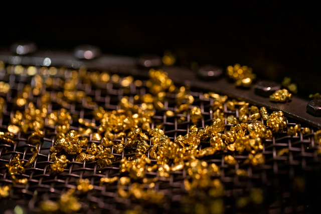 an image of gold granules in tray
