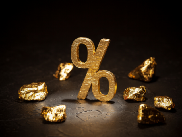 a gold percetange symbol and gold nuggets