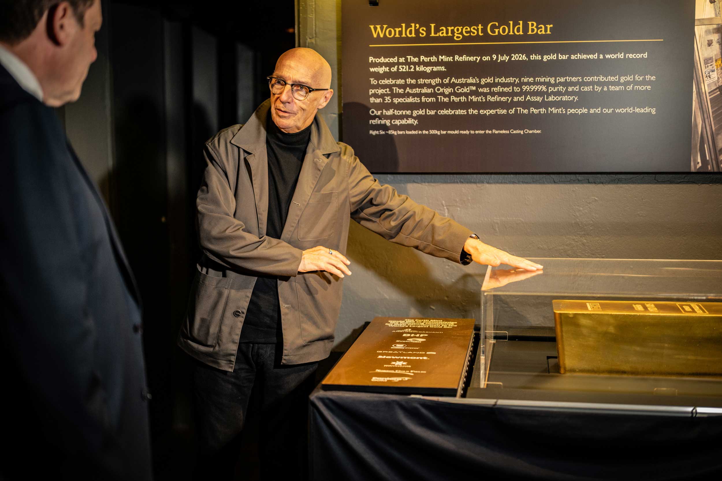 Musician Midge Ure in the Perth Mint exhibition looking at the world's largest gold bar display