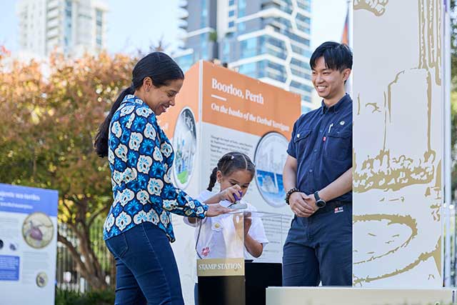 Mother and Child with Perth Mint Tour Guide in the exhibit