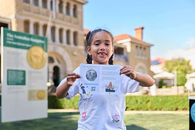 Child with the stamping passport activity