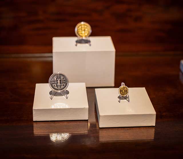 a collection of Perth Mint coins commemorating Queen Elizabeth II's 100th anniversary