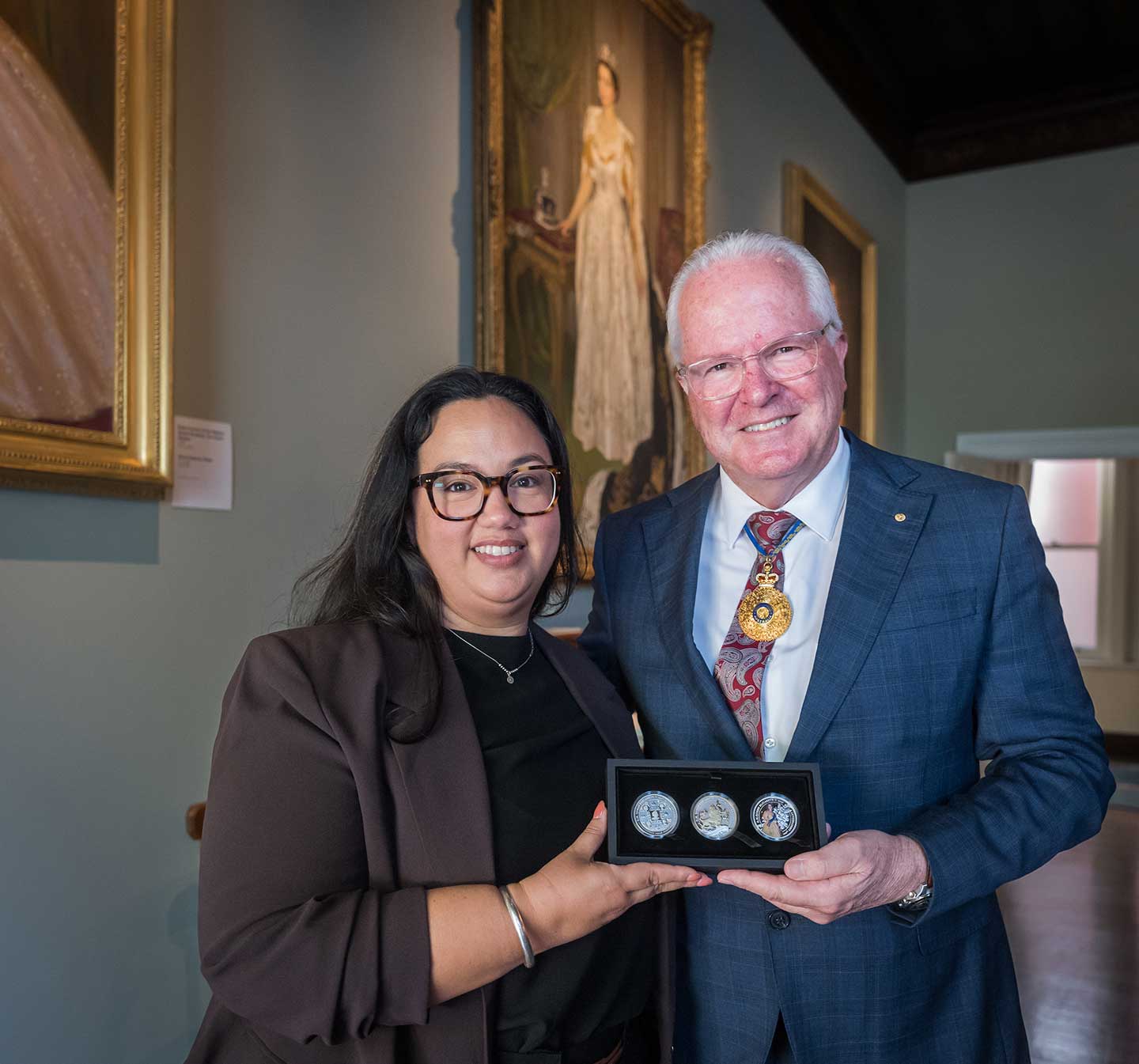 His Excellency, The Honourable Chris Dawson AC APM, Governor of Western Australia and Perth Mint Designer, Natasha Muhl at Government house